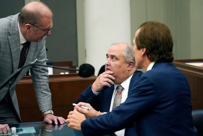Davis, center, conferred with his lawyers during a court appearance.